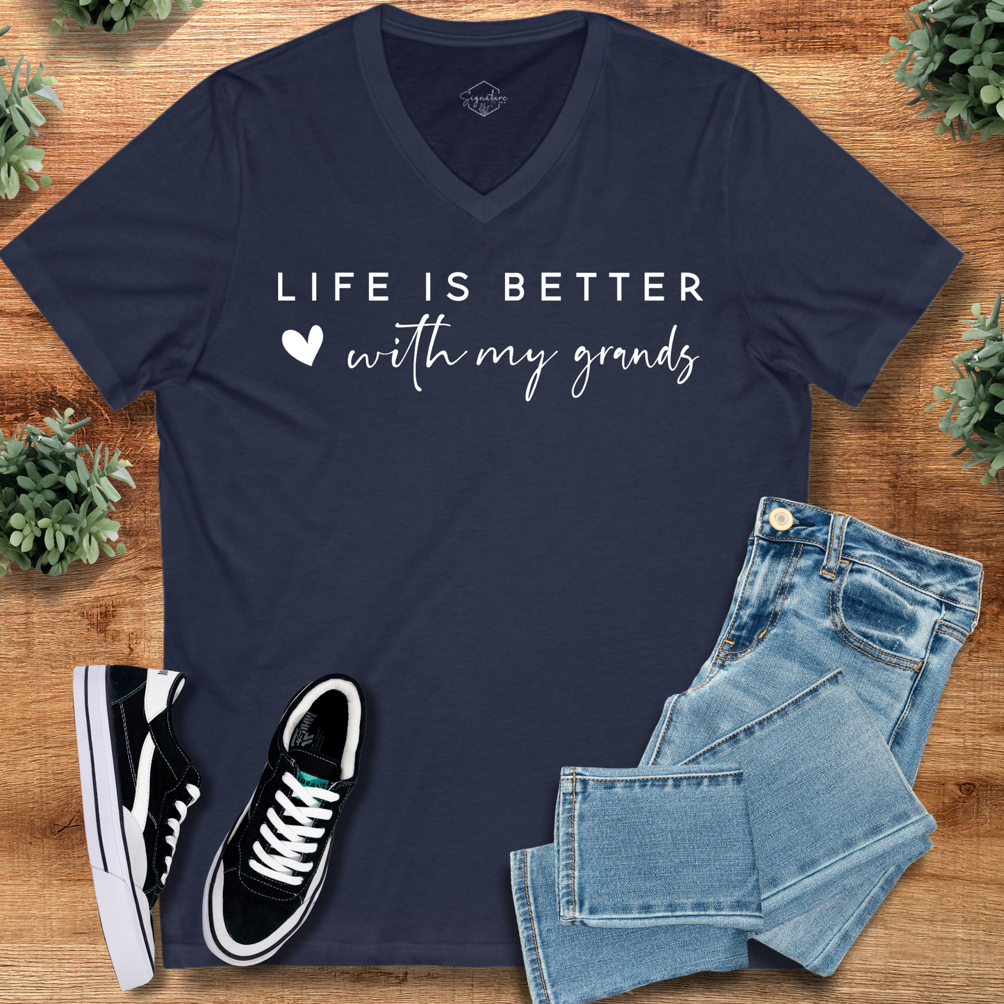 Navy Life Better with Grands Tee - Grandparents V-Neck styled with jeans and sneakers. Ideal for casual family gatherings and Grandparents Day.