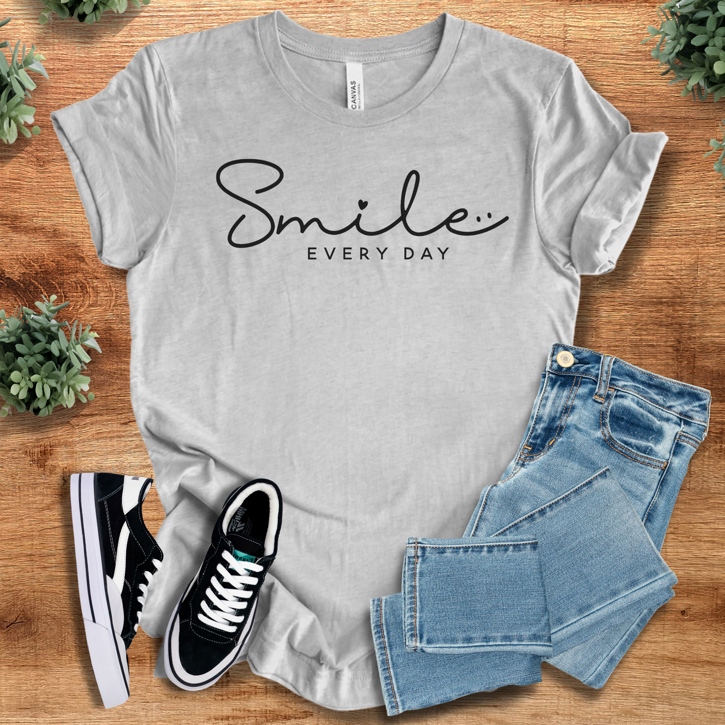 Light grey Smile Every Day T‑Shirt on Bella+Canvas 3001, paired with denim and sneakers. Minimalist soft unisex tee with positive vibes design.