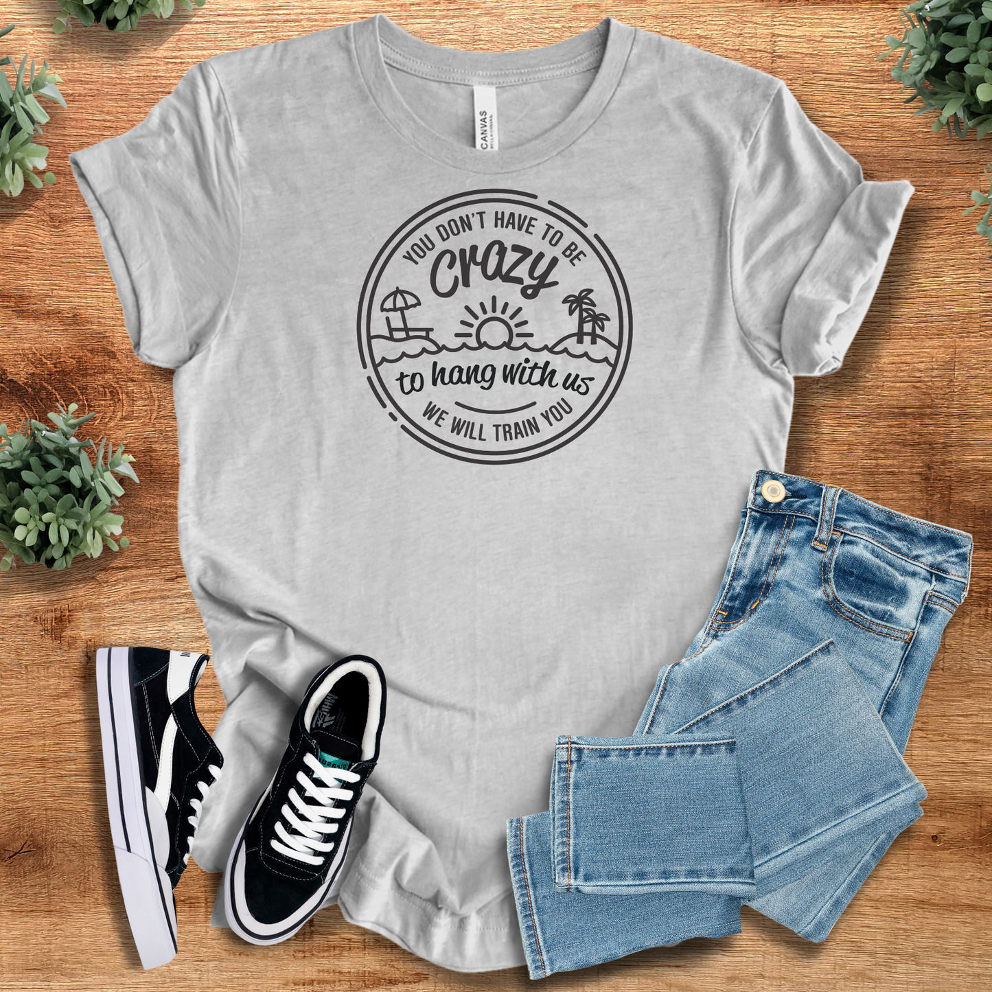 Light gray unisex humor t-shirt featuring a beach-themed 'We'll Train You' quote. Perfect for matching group outfits or vacation shirts.