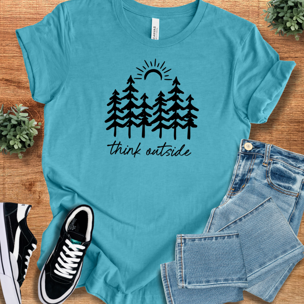 Heather-aqua t-shirt with '' text, flat lay styled on a wooden surface.