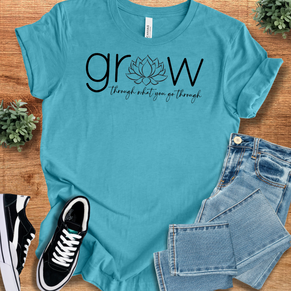 Soft-cream t-shirt with '' text, flat lay styled on a wooden surface.