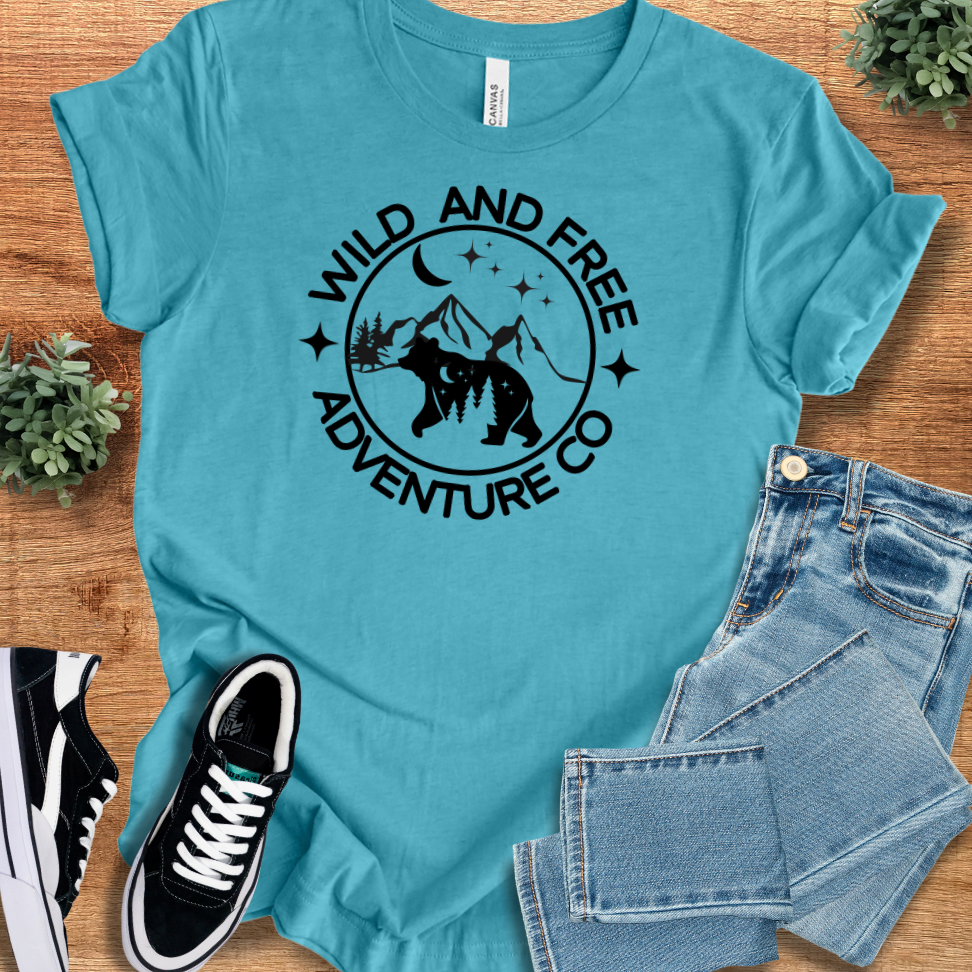 Athletic-heather t-shirt with '' text, flat lay styled on a wooden surface.