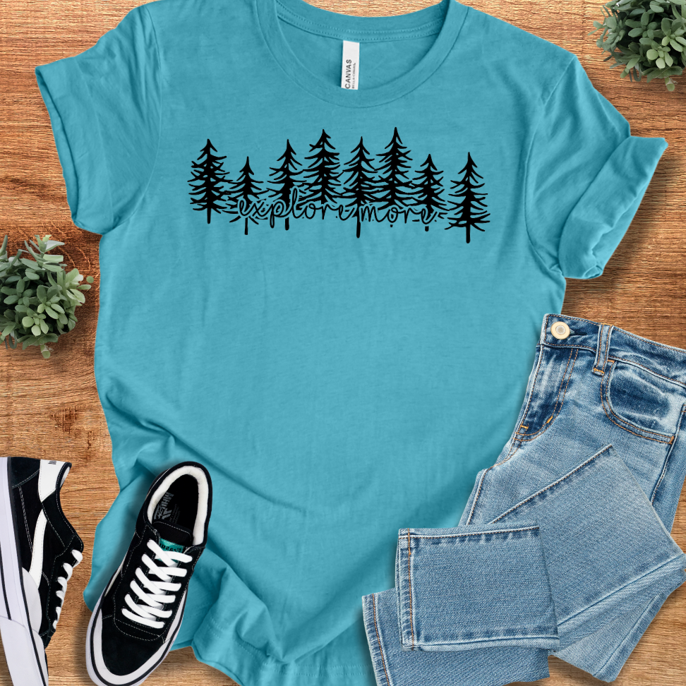 Heather-aqua t-shirt with '' text, flat lay styled on a wooden surface.