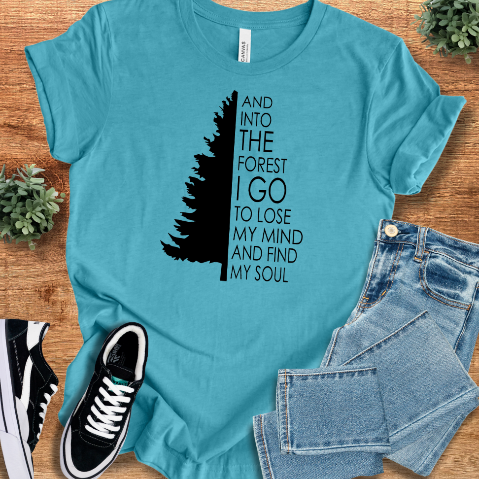 Heather-aqua t-shirt with '' text, flat lay styled on a wooden surface.