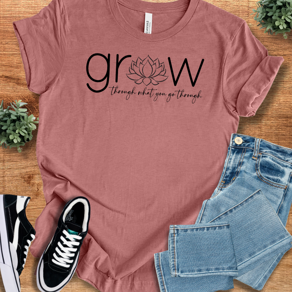 Soft-cream t-shirt with '' text, flat lay styled on a wooden surface.