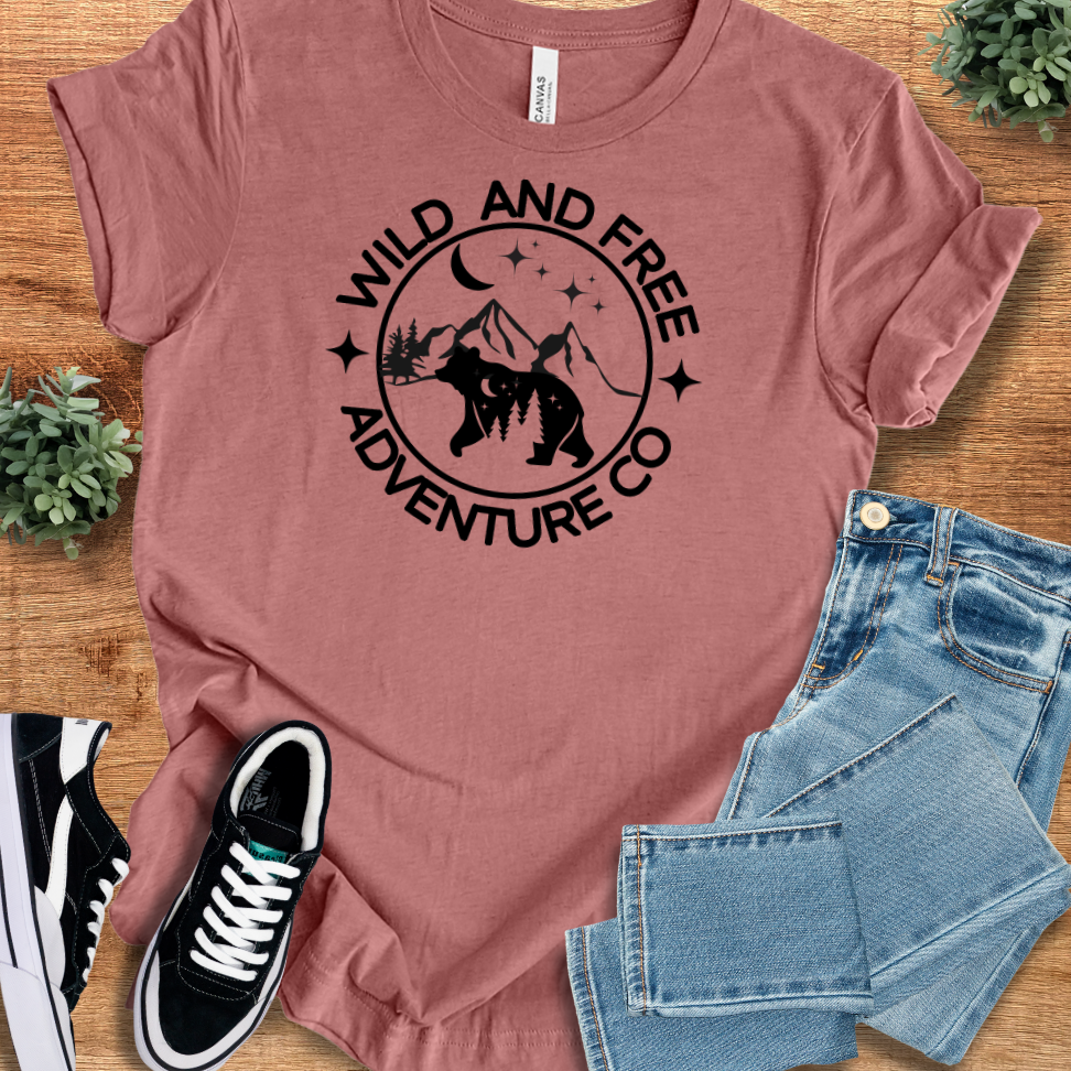 Athletic-heather t-shirt with '' text, flat lay styled on a wooden surface.