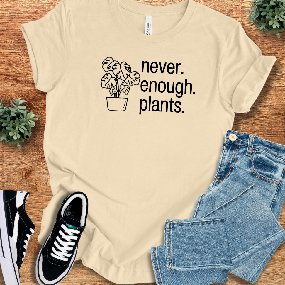 Heather-aqua t-shirt with '' text, flat lay styled on a wooden surface.