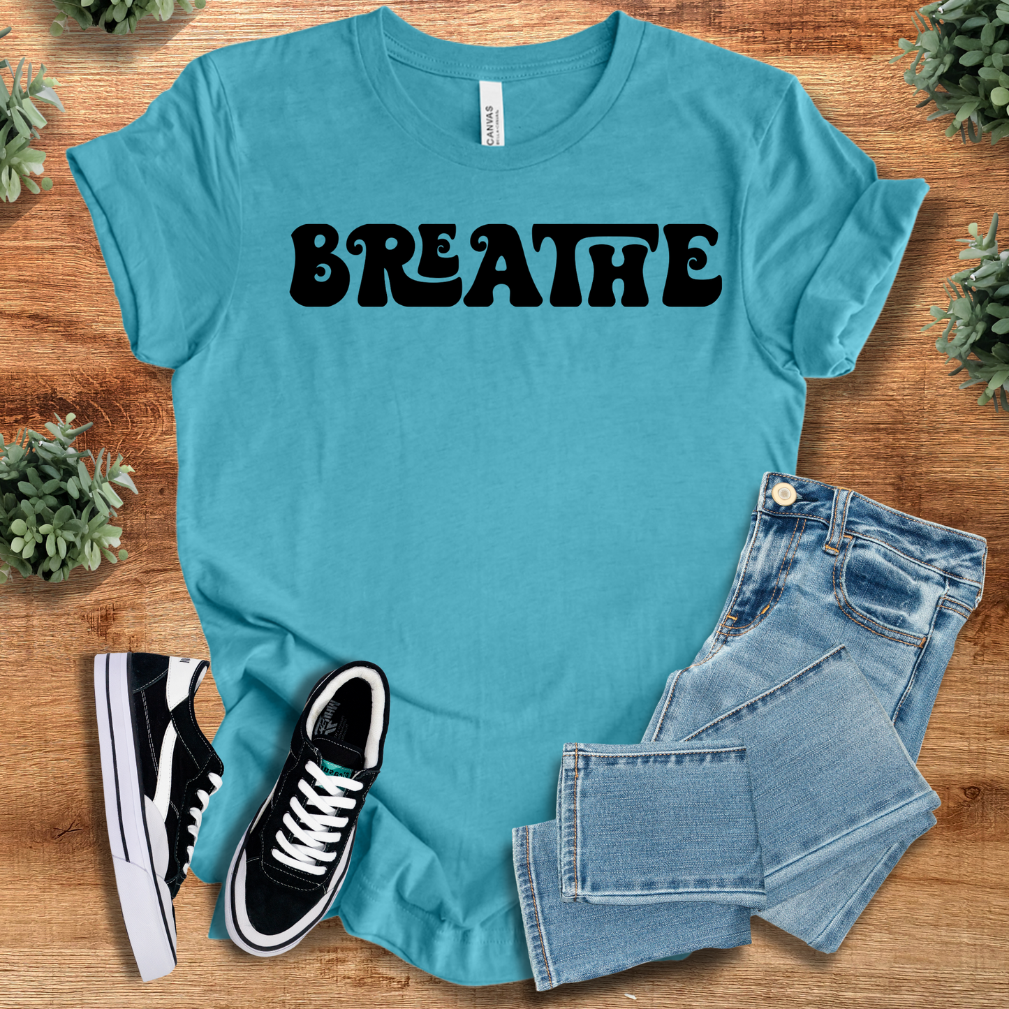 Retro Style T-Shirt - Breathe Tee in turquoise blue with black lettering. Lightweight cotton tee perfect for casual outfits and relaxation apparel.