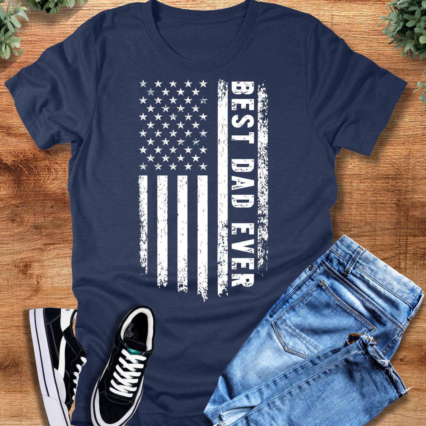 Black t-shirt with '' text, flat lay styled on a wooden surface.