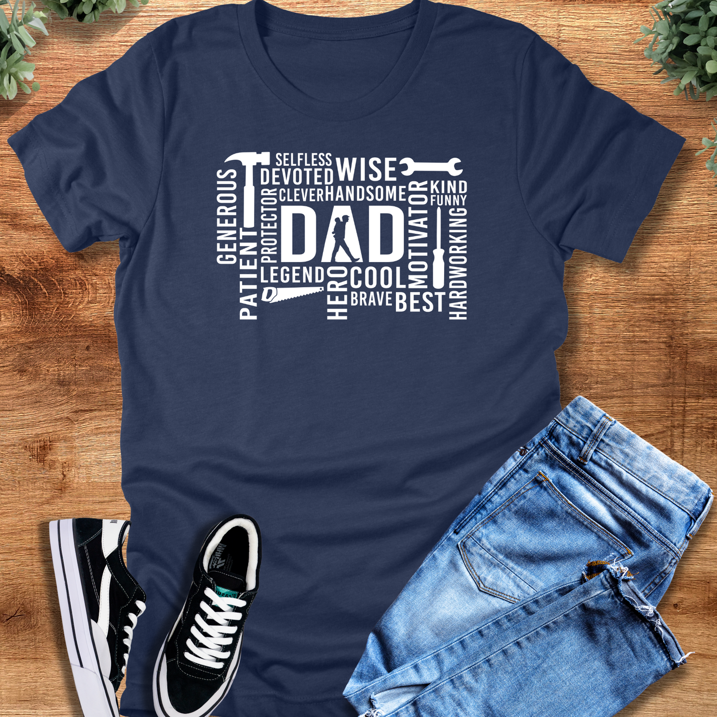 Black t-shirt with '' text, flat lay styled on a wooden surface.
