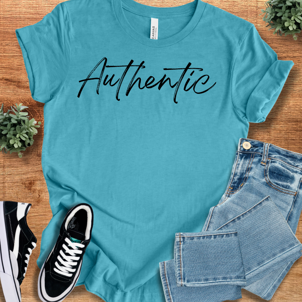 Athletic-heather t-shirt with '' text, flat lay styled on a wooden surface.