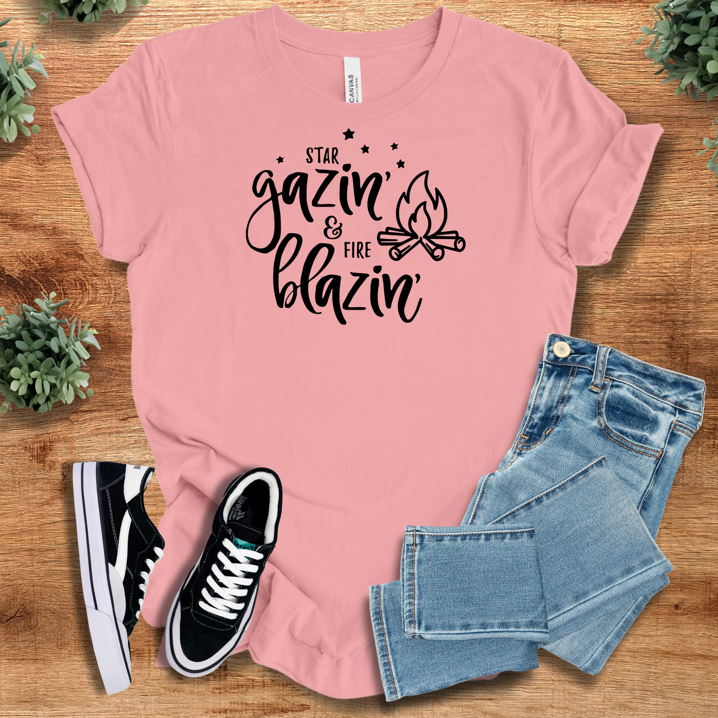 Athletic-heather t-shirt with '' text, flat lay styled on a wooden surface.