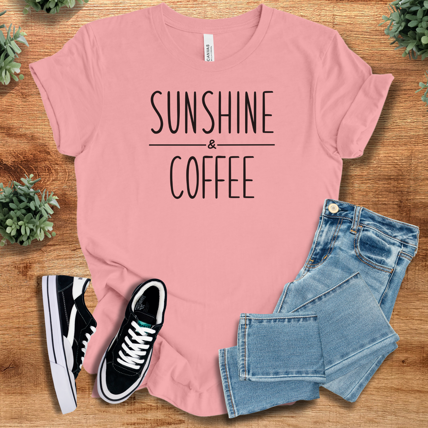 Athletic-heather t-shirt with '' text, flat lay styled on a wooden surface.