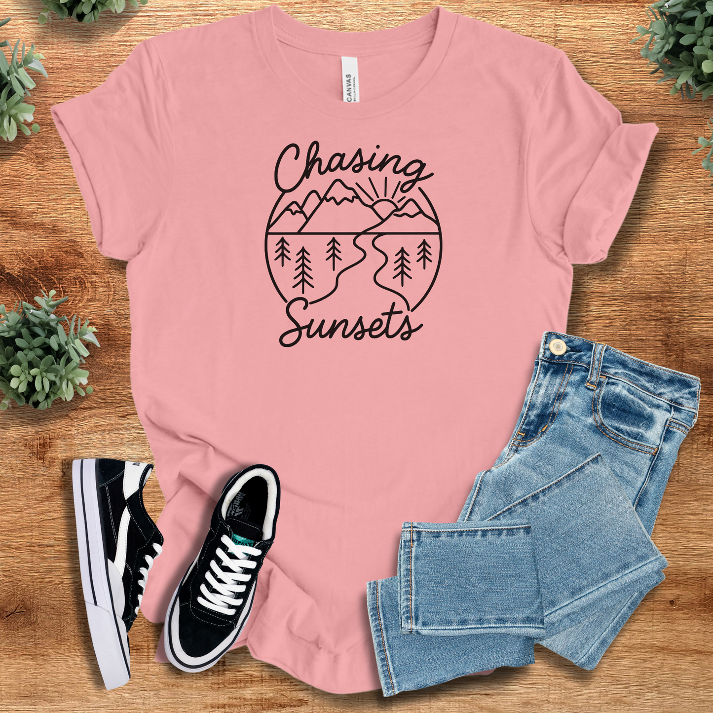 Soft-cream t-shirt with '' text, flat lay styled on a wooden surface.