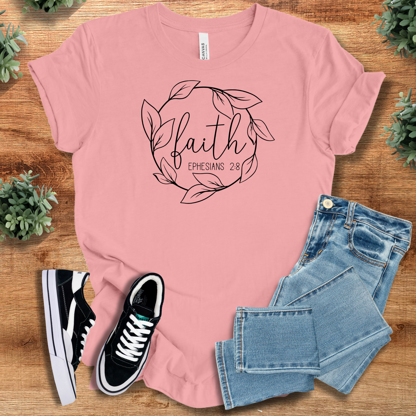 Pink Faith Ephesians 2:8 T-Shirt with black scripture and leaf motif. Lightweight Christian-themed top for stylish religious expression.