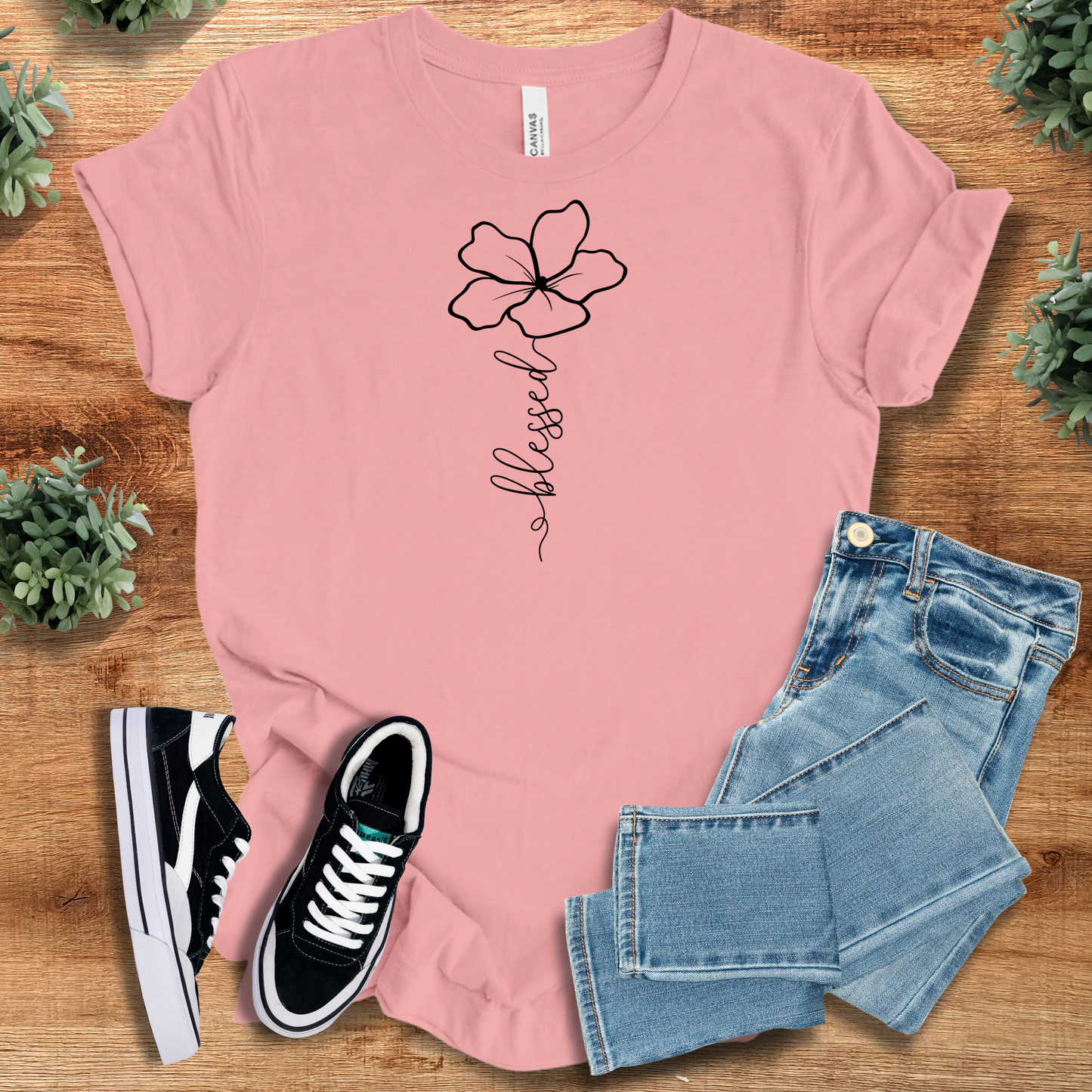 Light pink Blessed Flower Tee with black flower graphic and 'blessed' script, soft cotton Christian T-shirt perfect for floral fashion lovers.
