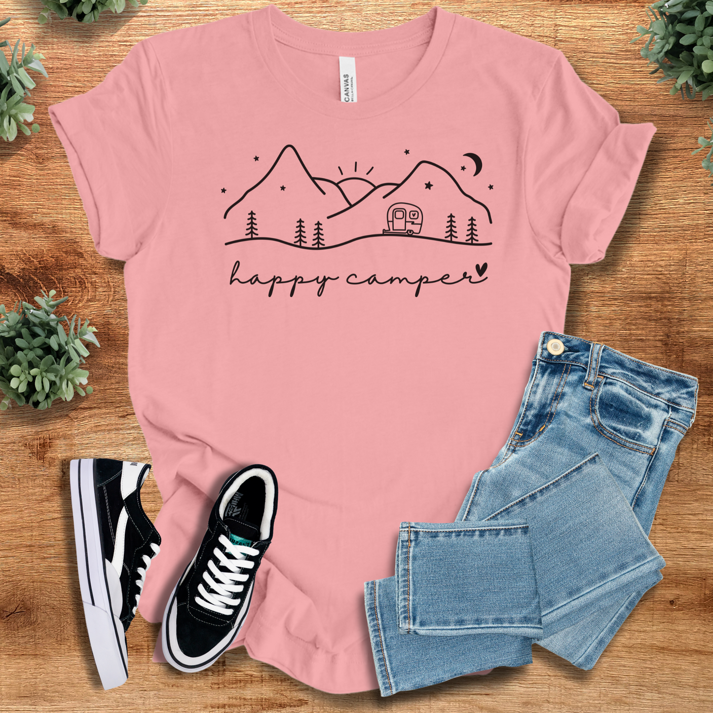 Heather-aqua t-shirt with '' text, flat lay styled on a wooden surface.