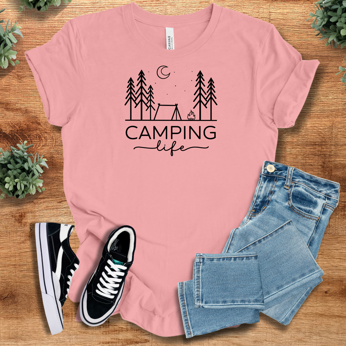 Heather-aqua t-shirt with '' text, flat lay styled on a wooden surface.