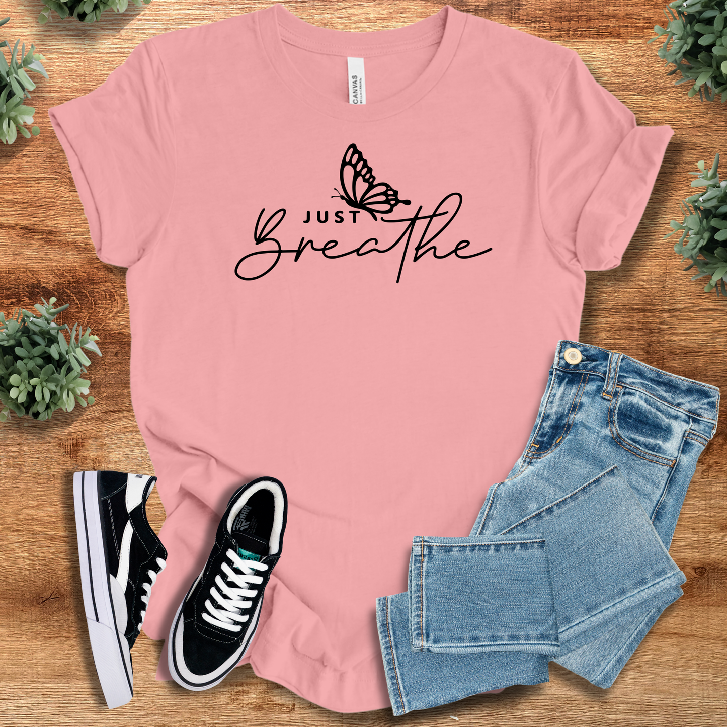 Light pink Just Breathe Tee T‑Shirt on Bella+Canvas 3001 with black butterfly script, perfect uplifting apparel gift.