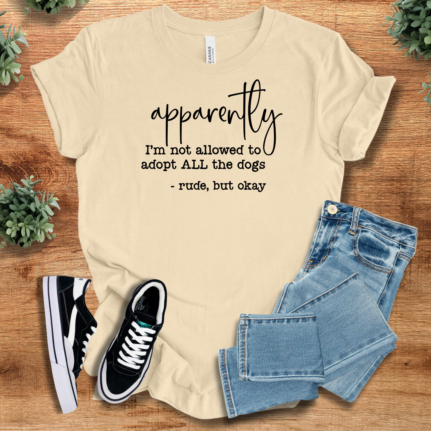 Funny dog lover t-shirt in beige with 'Apparently I'm Not Allowed to Adopt All the Dogs' quote. Lightweight combed cotton for casual wear.
