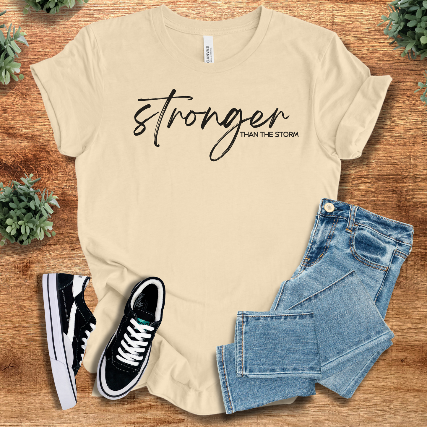 Heather-mauve t-shirt with '' text, flat lay styled on a wooden surface.