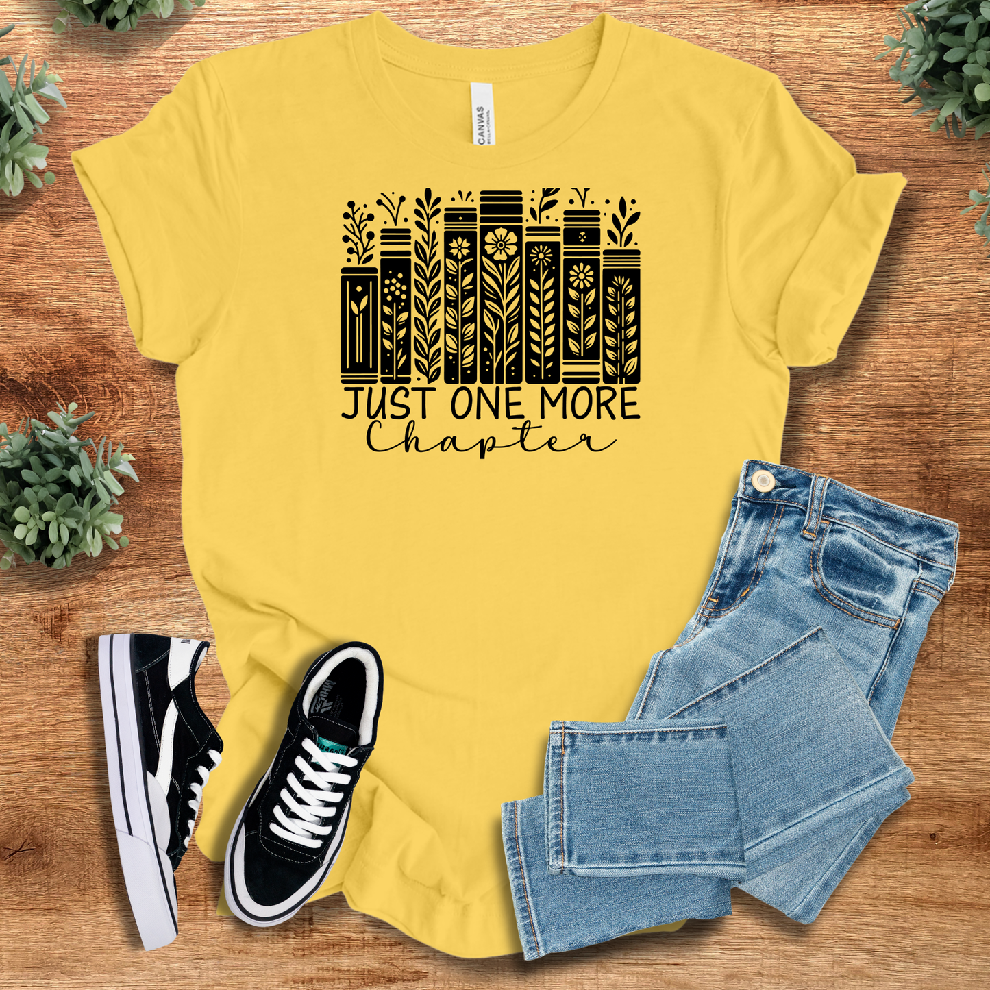 Athletic-heather t-shirt with '' text, flat lay styled on a wooden surface.