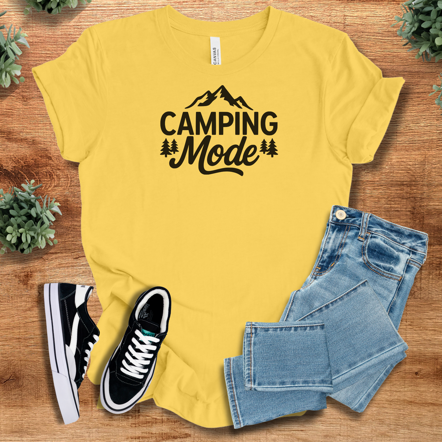 Athletic-heather t-shirt with '' text, flat lay styled on a wooden surface.