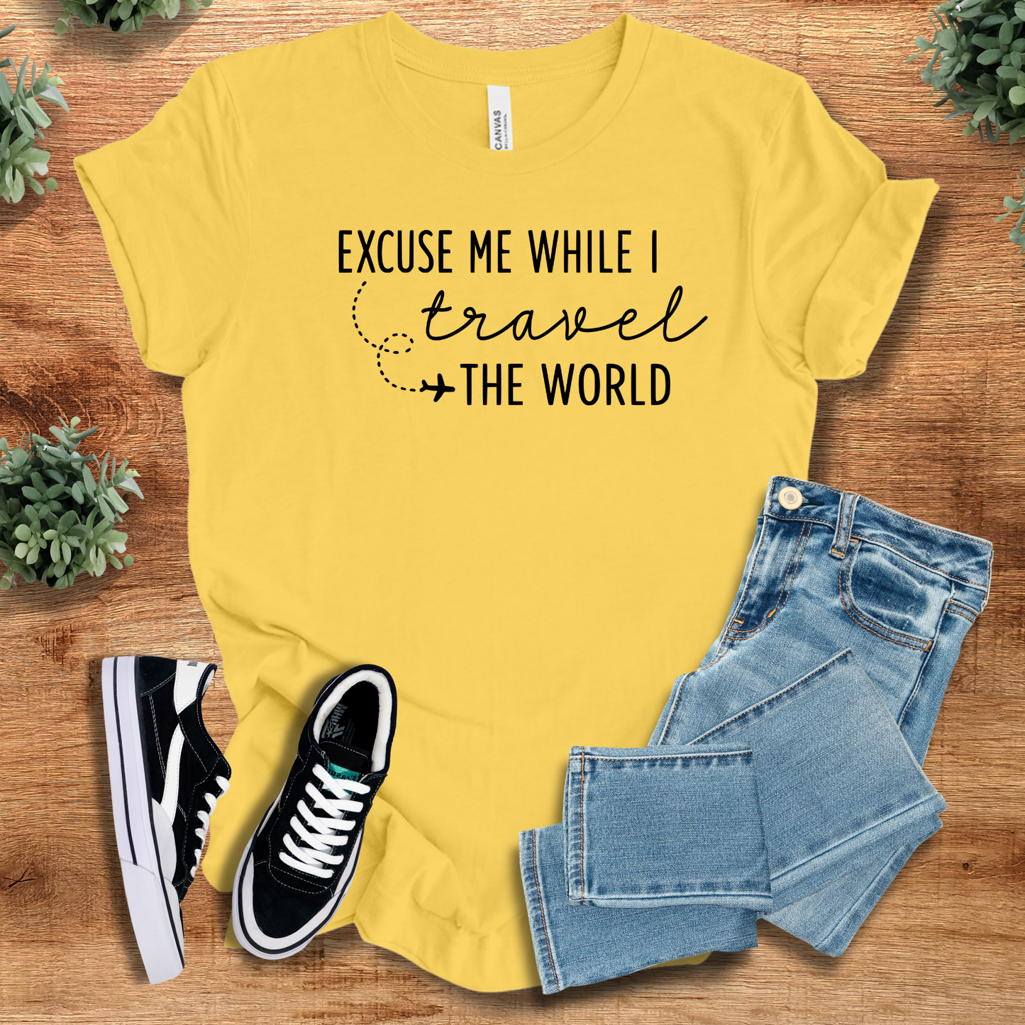 Athletic-heather t-shirt with '' text, flat lay styled on a wooden surface.