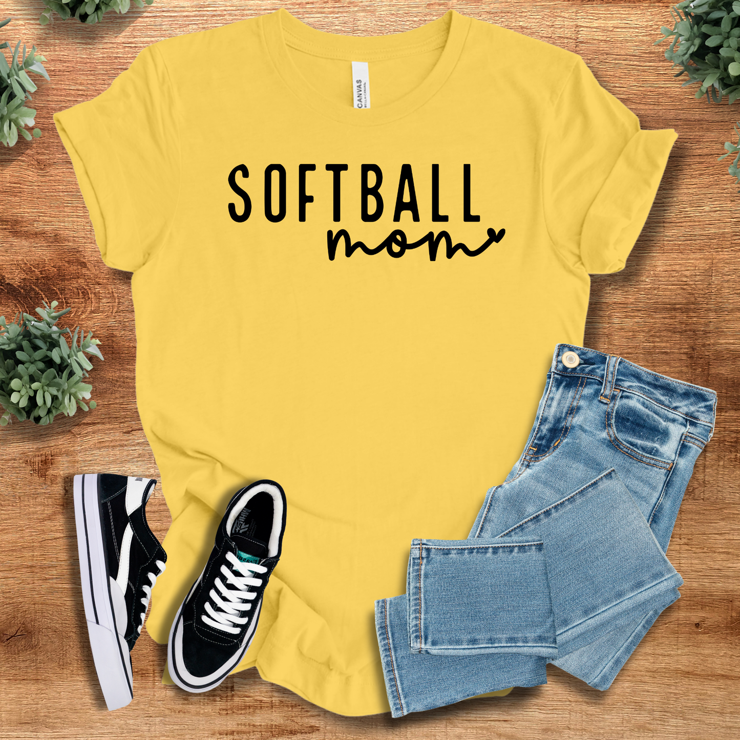Athletic-heather t-shirt with '' text, flat lay styled on a wooden surface.