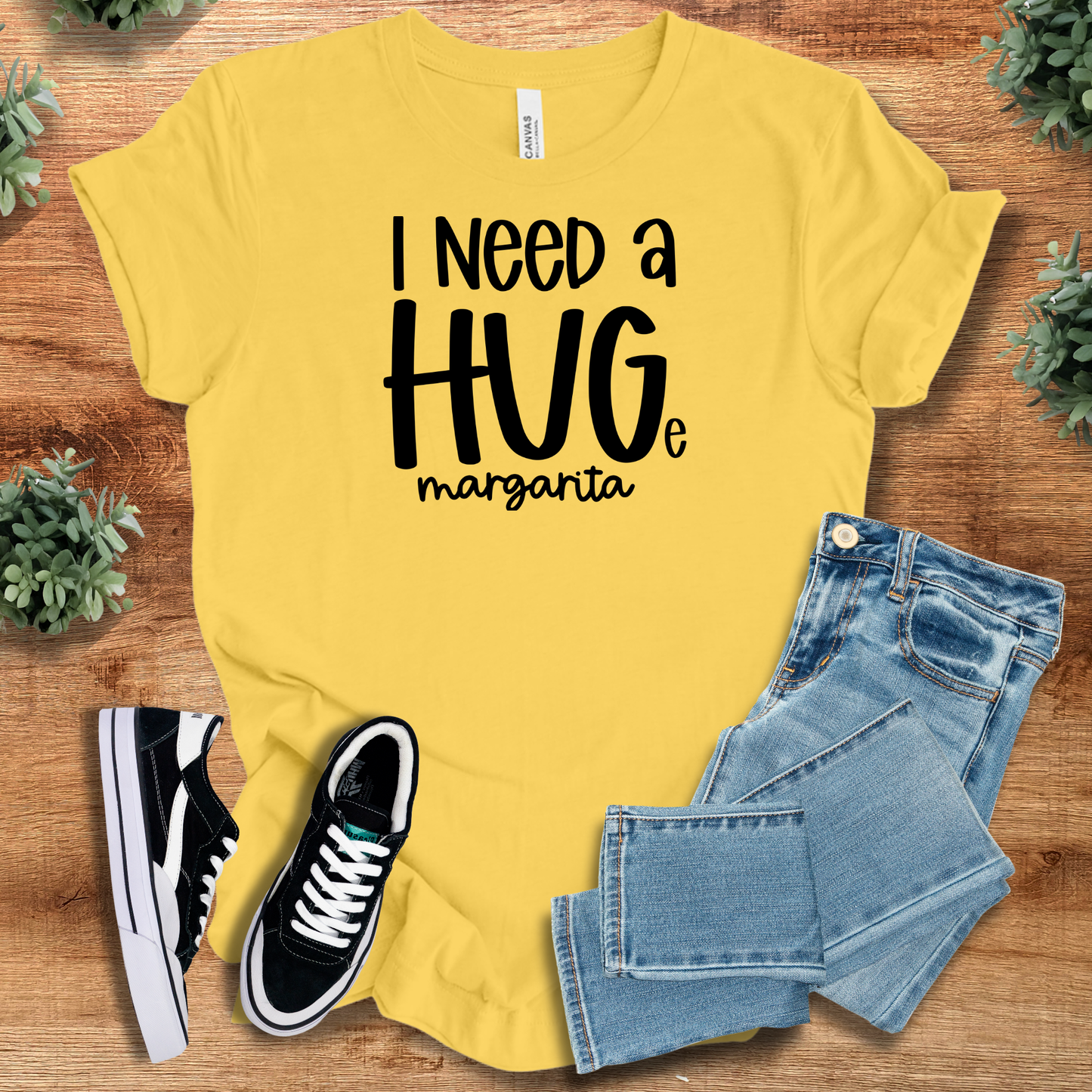 Athletic-heather t-shirt with '' text, flat lay styled on a wooden surface.