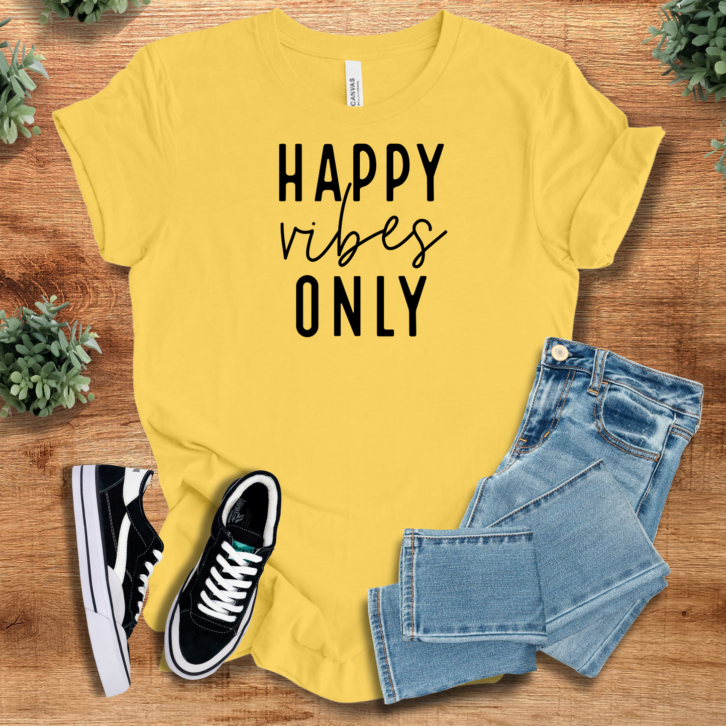 Athletic-heather t-shirt with '' text, flat lay styled on a wooden surface.