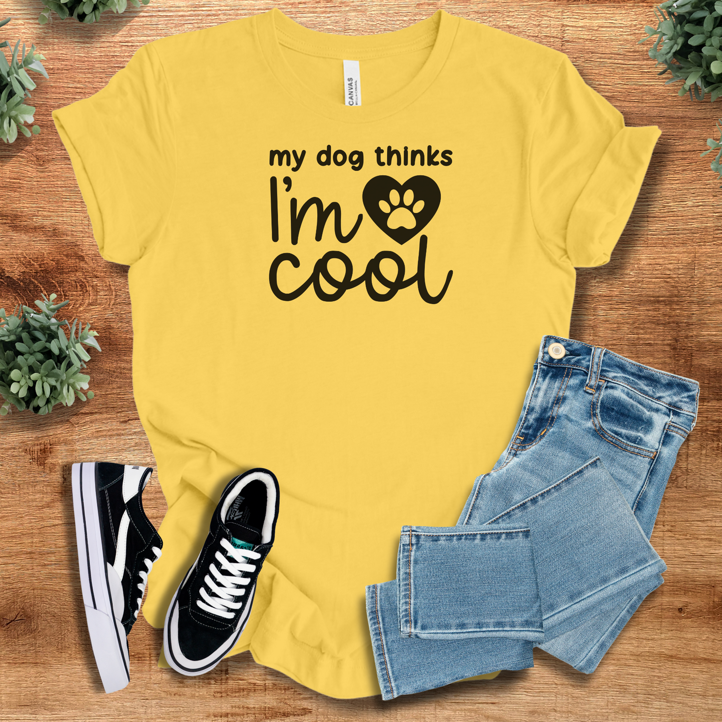 Athletic-heather t-shirt with '' text, flat lay styled on a wooden surface.