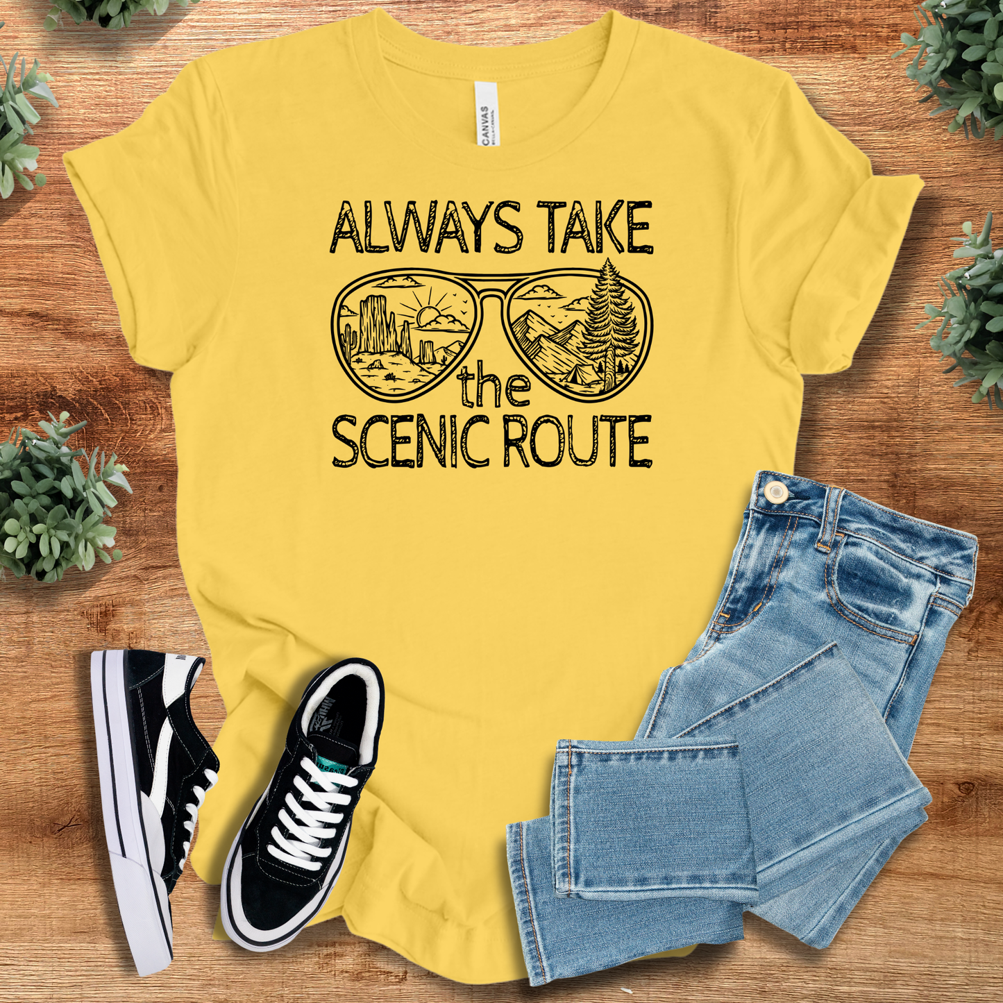 Athletic-heather t-shirt with '' text, flat lay styled on a wooden surface.