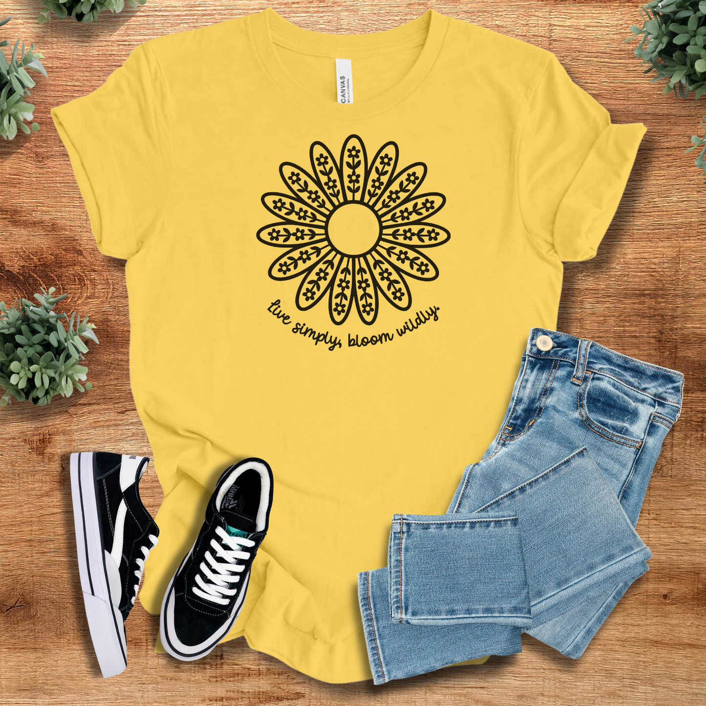 Athletic-heather t-shirt with '' text, flat lay styled on a wooden surface.