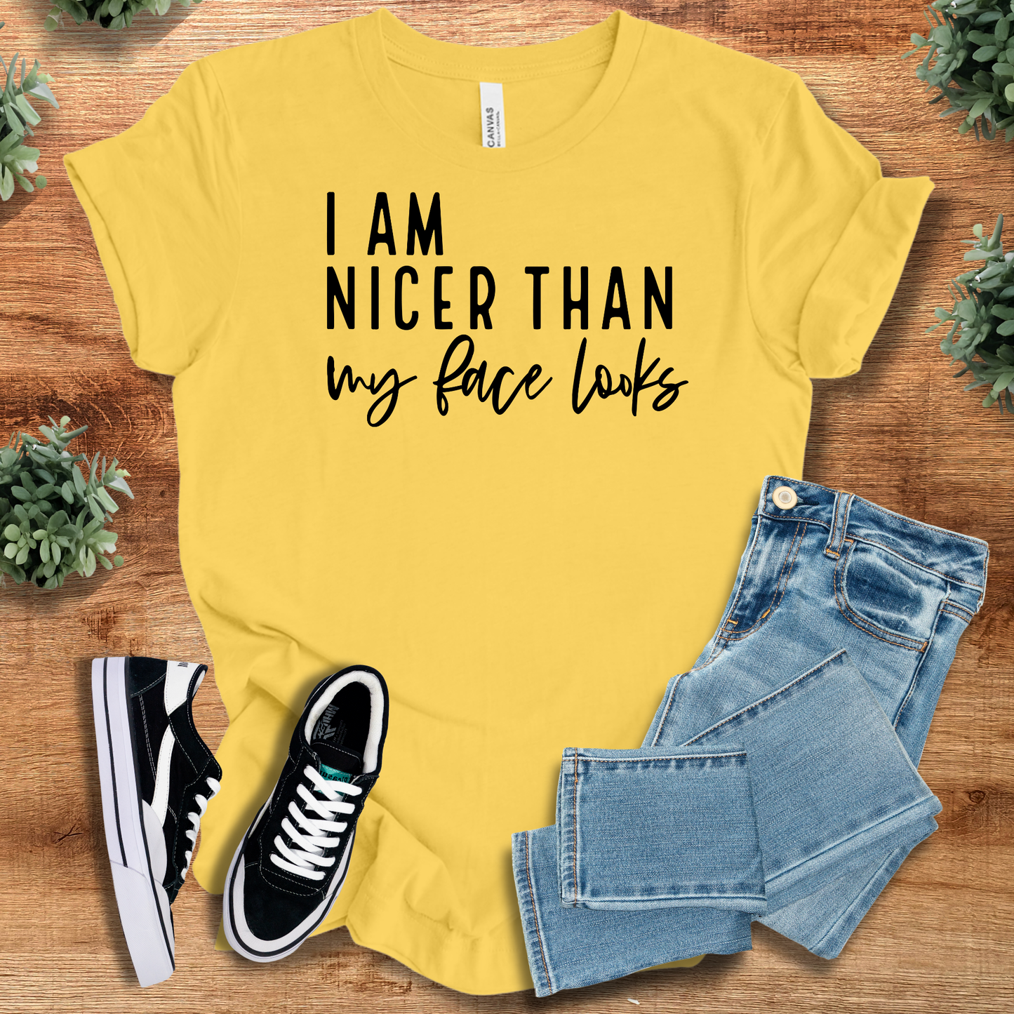 Athletic-heather t-shirt with '' text, flat lay styled on a wooden surface.