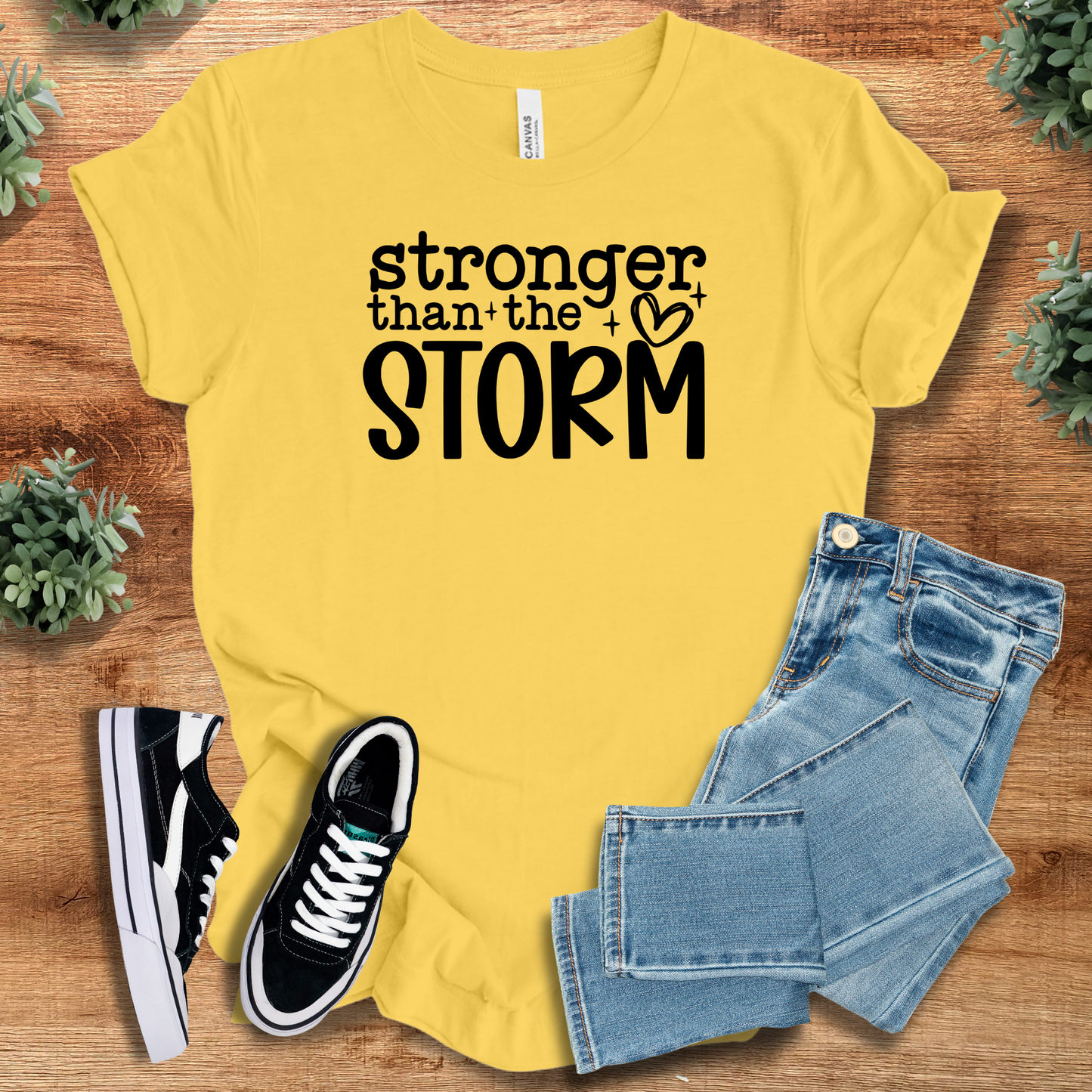 Athletic-heather t-shirt with '' text, flat lay styled on a wooden surface.