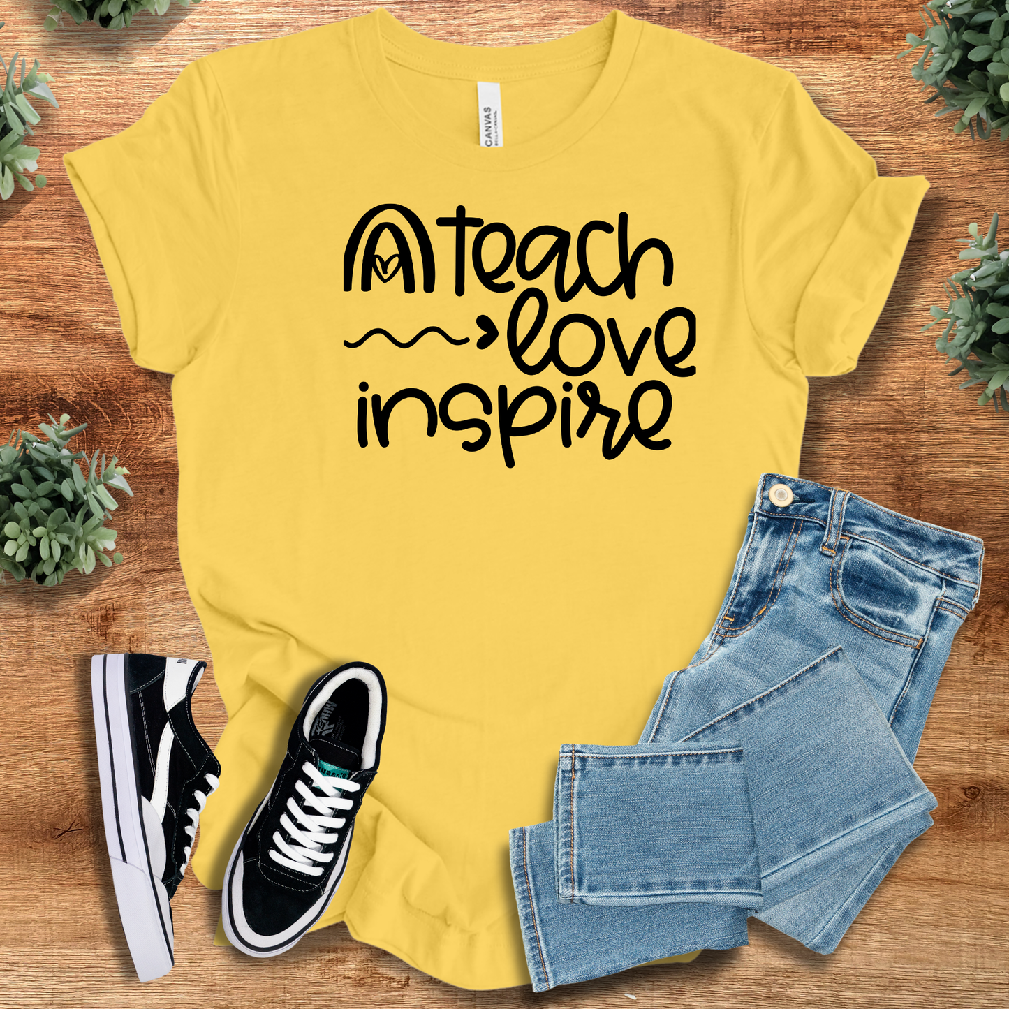 Athletic-heather t-shirt with '' text, flat lay styled on a wooden surface.