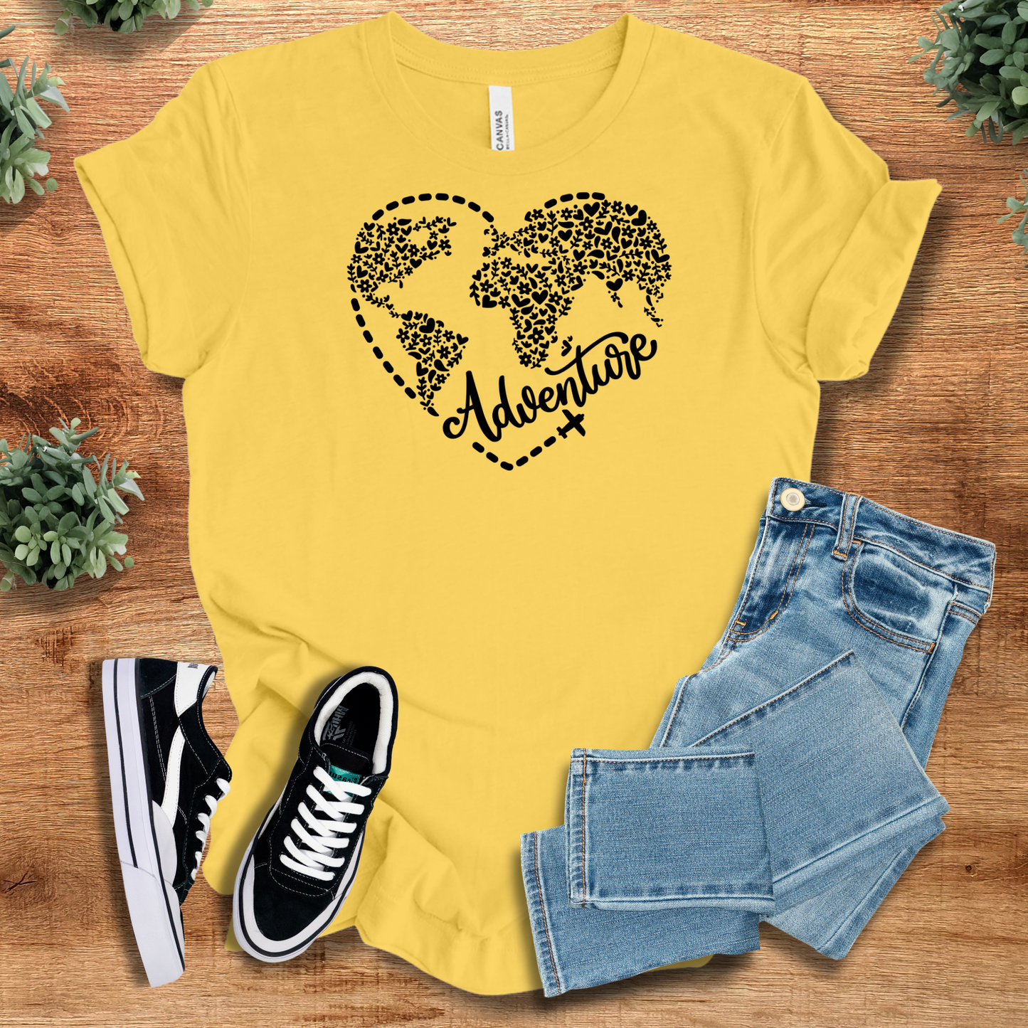 Athletic-heather t-shirt with '' text, flat lay styled on a wooden surface.