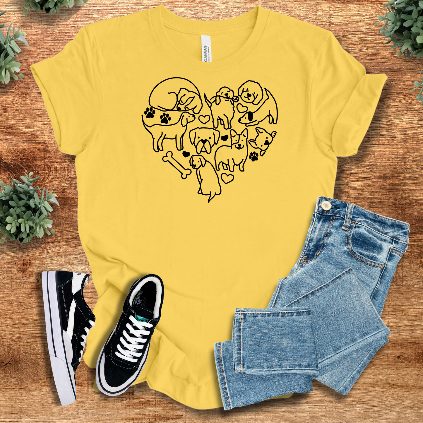 Heather-aqua t-shirt with '' text, flat lay styled on a wooden surface.
