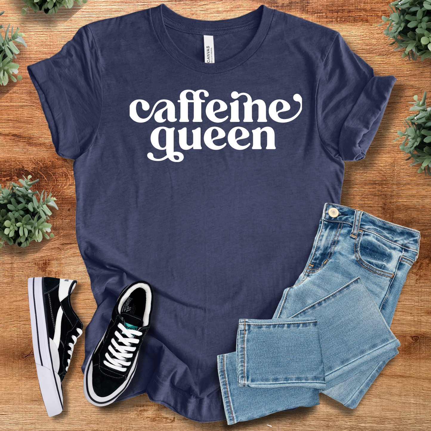 Caffeine Queen - Coffee Lovers T-Shirt in navy blue featuring white graphic text. Breathable cotton tee paired with denim and black sneakers.