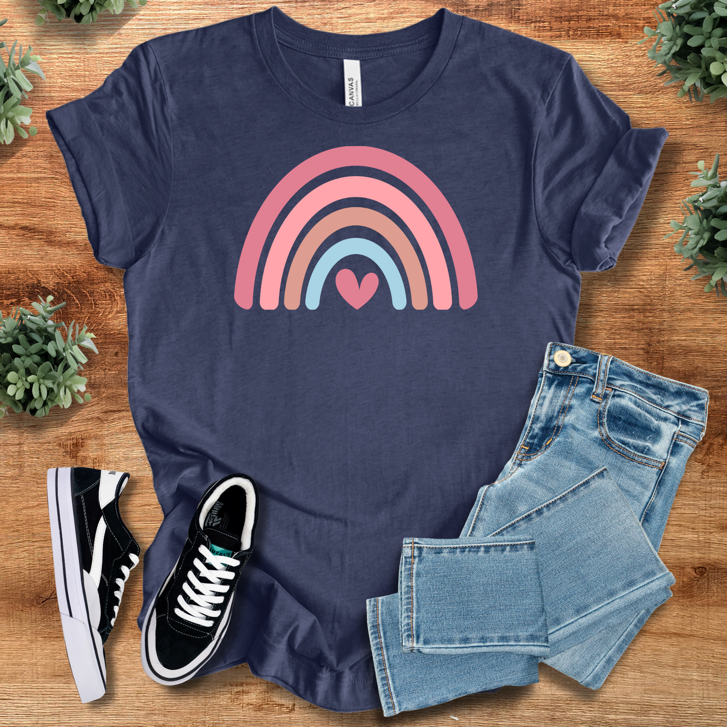 Heart Rainbow Tee in navy blue featuring a pink and blue rainbow with heart design. 100% cotton casual fit T-shirt for everyday wear.