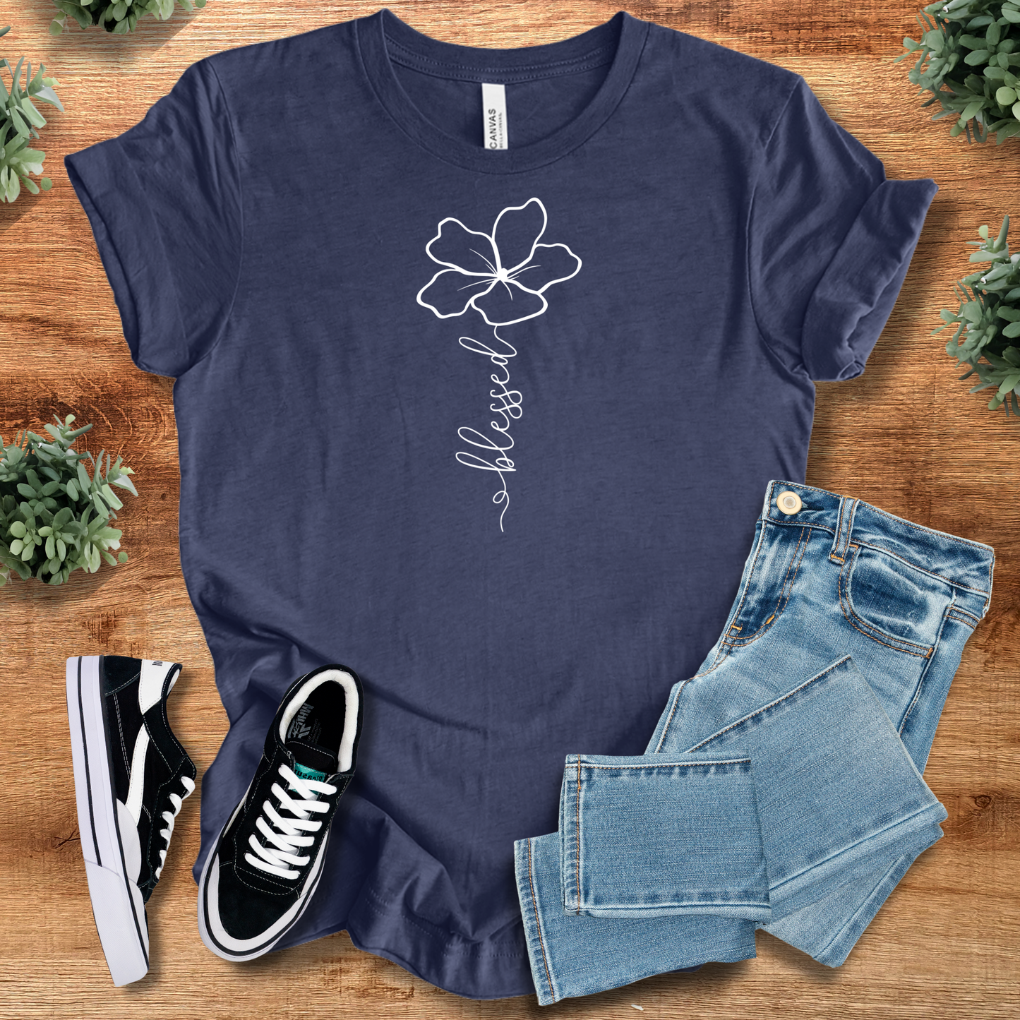 Navy Blessed Flower Tee with white floral design and 'blessed' text, inspirational Christian cotton shirt for stylish faith expression.