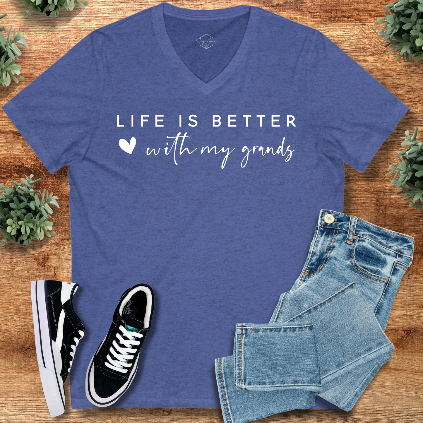 Heather blue Life Better with Grands V-Neck Tee for grandparents, styled with jeans. Great for family reunions and everyday comfort.