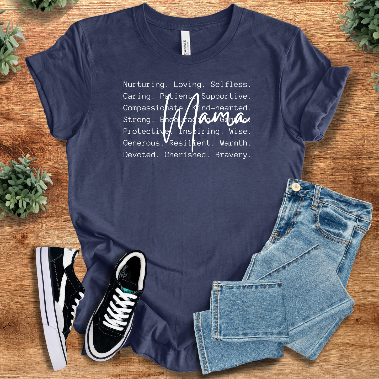 Heather-mauve t-shirt with '' text, flat lay styled on a wooden surface.