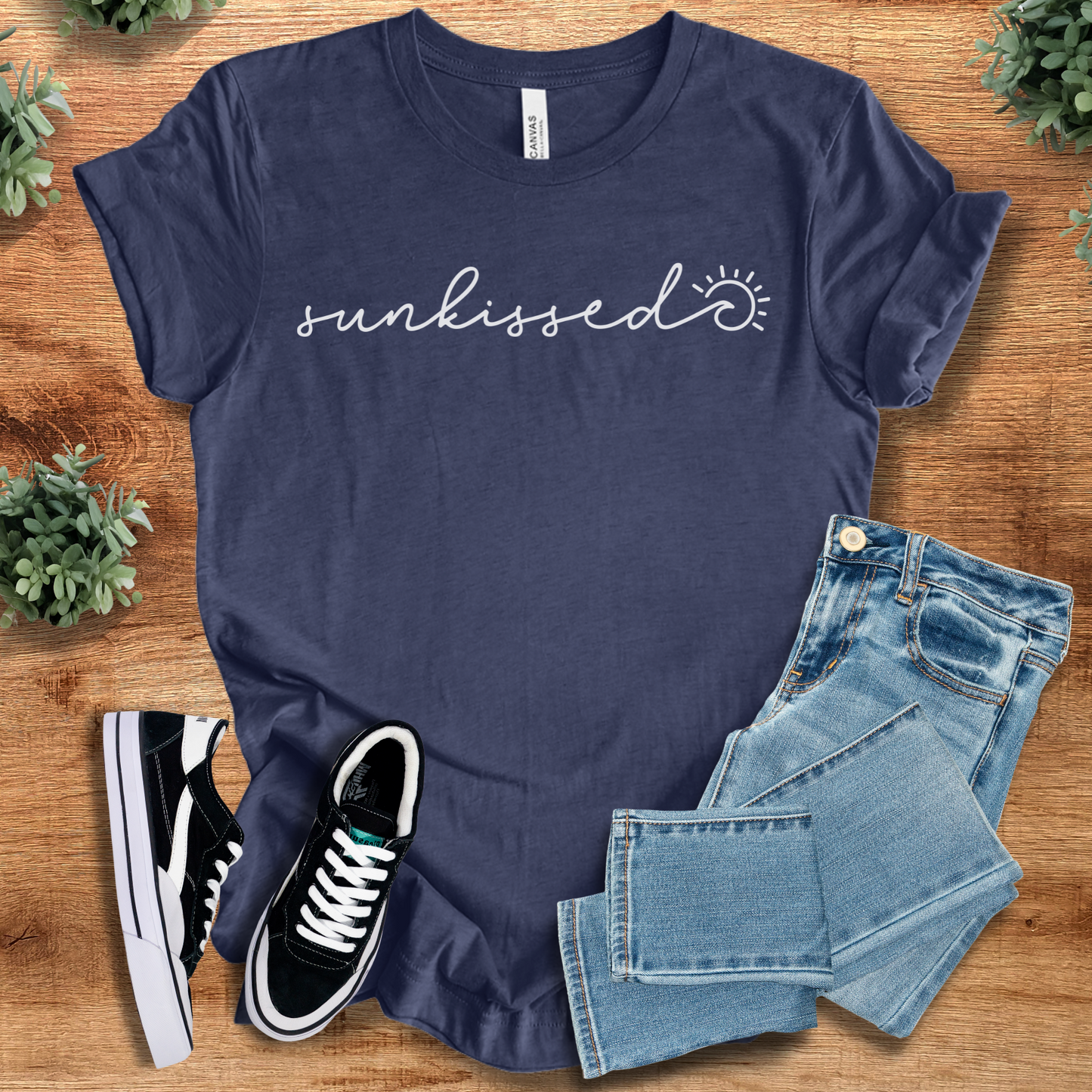 Soft-cream t-shirt with '' text, flat lay styled on a wooden surface.