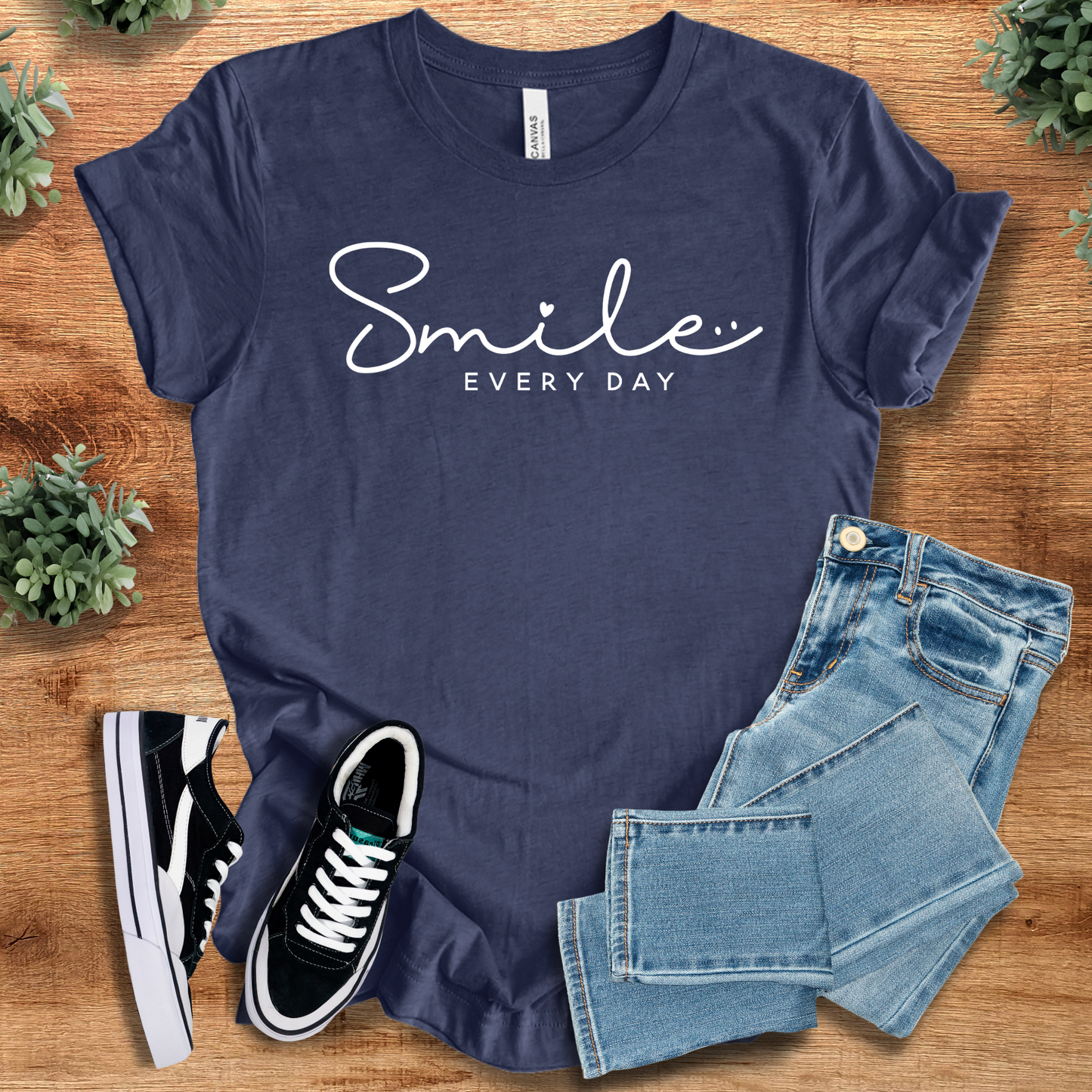 Navy Smile Every Day T‑Shirt on Bella+Canvas 3001, styled with jeans and sneakers. Soft unisex tee with white minimalist text for daily positivity.