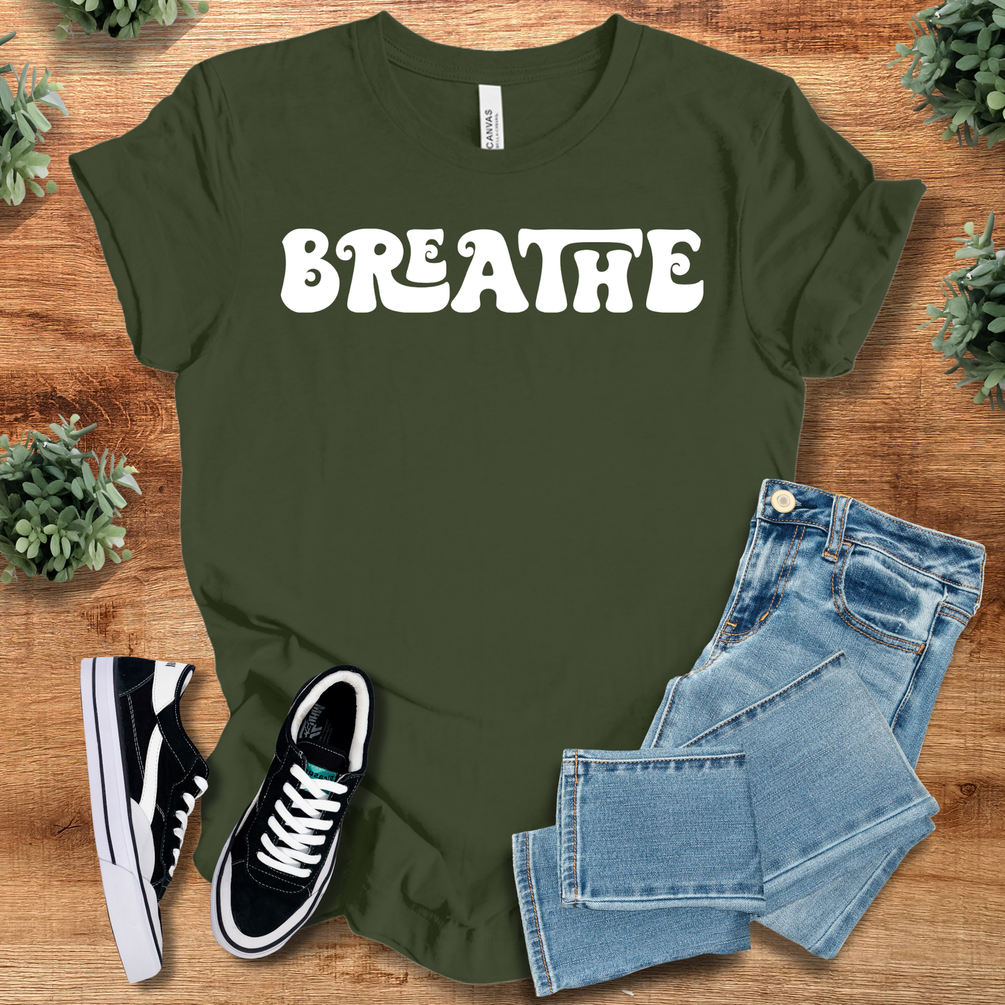 Retro Style T-Shirt - Breathe Tee in olive green featuring bold white 'BREATHE' text. Soft cotton fabric perfect for mindfulness and casual wear.