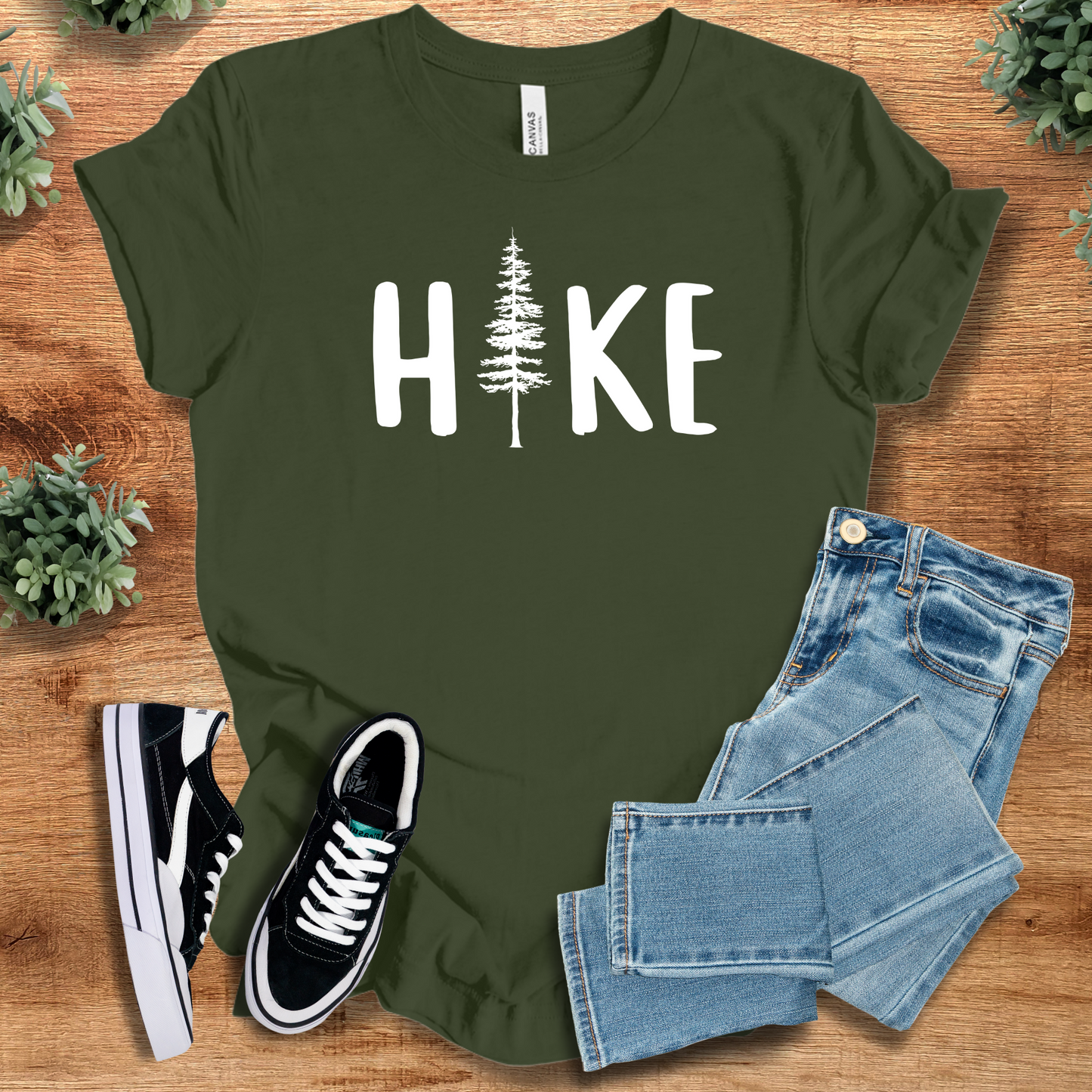 Hike T‑Shirt in forest green Bella+Canvas 3001 with white tree print. Comfy unisex minimalist tee for hiking and nature lovers.