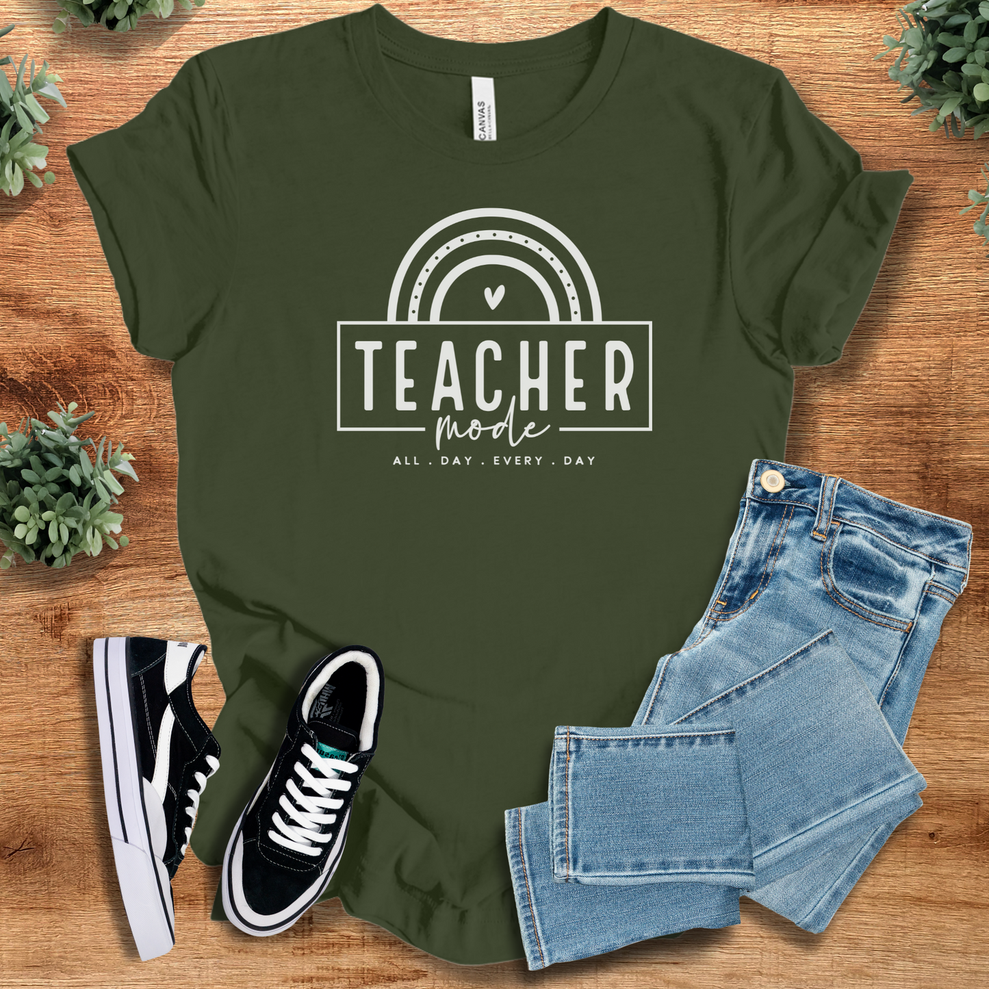 Soft-cream t-shirt with '' text, flat lay styled on a wooden surface.