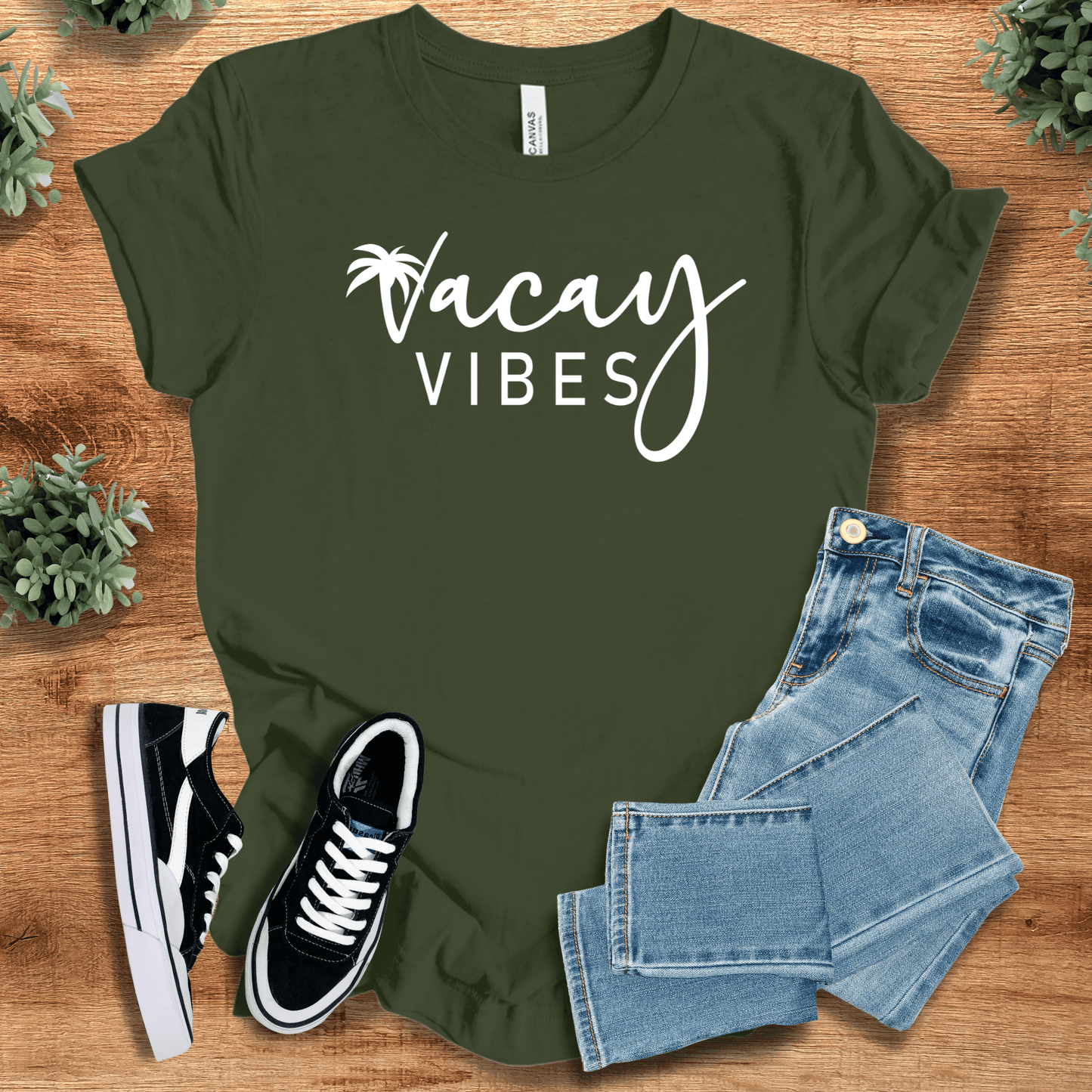 Soft-cream t-shirt with '' text, flat lay styled on a wooden surface.